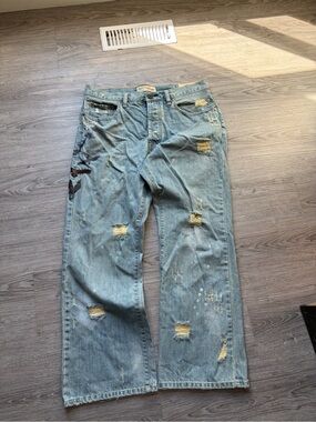 Men's Distressed Light Blue Denim Jeans